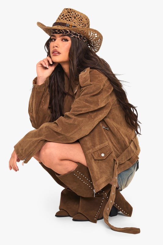 Oversized biker jacket in faux suede for a bold, edgy look
        Asymmetrical zip front closure for a modern twist
        Notched lapels and epaulettes for classic biker style
        Belted hem for adjustable fit and added flair
        Multiple pockets for both style and functionality
    
    Make a statement with this oversized biker jacket that combines timeless style with contemporary flair. The faux suede fabric offers a luxurious look and feel, perfect for those seeking a cruelty-free alternative. Its relaxed fit allows for easy layering, making it ideal for transitional weather. Style it with a simple white tee and denim shorts for a casual daytime look, or throw it over a floral dress for an edgy contrast at informal gatherings. For cooler evenings, pair with skinny jeans and ankle boots to create a sleek silhouette. The versatile nature of this jacket makes it a go-to piece for various casual occasions, from coffee dates to family barbecues. Its ability to effortlessly elevate any outfit ensures you'll stand out whilst remaining comfortably on-trend.