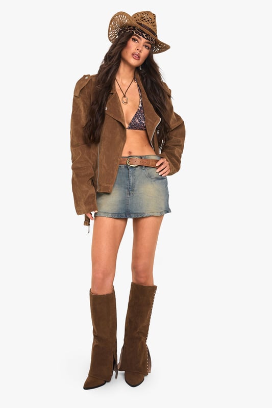 Oversized biker jacket in faux suede for a bold, edgy look
        Asymmetrical zip front closure for a modern twist
        Notched lapels and epaulettes for classic biker style
        Belted hem for adjustable fit and added flair
        Multiple pockets for both style and functionality
    
    Make a statement with this oversized biker jacket that combines timeless style with contemporary flair. The faux suede fabric offers a luxurious look and feel, perfect for those seeking a cruelty-free alternative. Its relaxed fit allows for easy layering, making it ideal for transitional weather. Style it with a simple white tee and denim shorts for a casual daytime look, or throw it over a floral dress for an edgy contrast at informal gatherings. For cooler evenings, pair with skinny jeans and ankle boots to create a sleek silhouette. The versatile nature of this jacket makes it a go-to piece for various casual occasions, from coffee dates to family barbecues. Its ability to effortlessly elevate any outfit ensures you'll stand out whilst remaining comfortably on-trend.