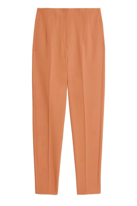 These trousers offer easy wear for smart and casual occasions alike. They have tapered legs with added stretch for comfort and an ankle-grazer length for a contemporary look. The elasticated high waist features double darts for a tailored effect and fastens securely with a hook bar and zip with a concealed button.