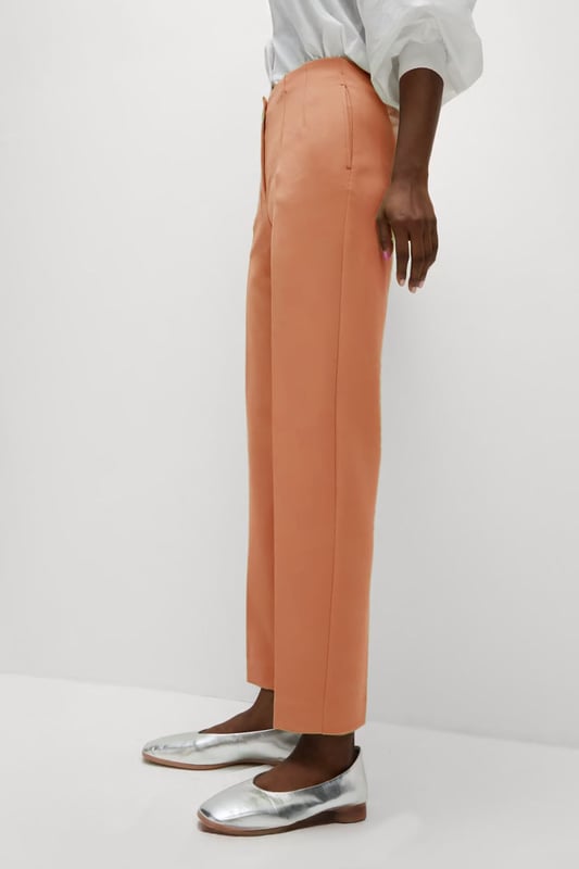 These trousers offer easy wear for smart and casual occasions alike. They have tapered legs with added stretch for comfort and an ankle-grazer length for a contemporary look. The elasticated high waist features double darts for a tailored effect and fastens securely with a hook bar and zip with a concealed button.