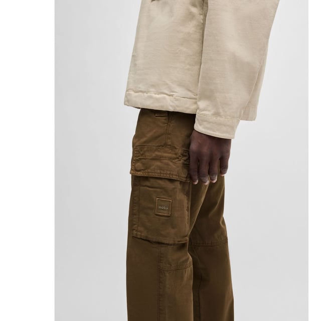 Mens BOSS Sisla-8 Cargo Trousers in Stretch-Cotton Twill in open green.Casual cargo trousers by BOSS Menswear. Featuring a logo patch on the pocket  this comfy pair is crafted in breathable stretch twill. This product’s raw material is derived from regenerative agriculture: an approach focused on preservation and restoration that aims to increase biodiversity  preserve water quality and improve soil health while absorbing CO2. Regenerative agriculture also promotes animal welfare and fair working conditions for farmers.- Regular fit- Regular rise- Button and zip closure- Fit foot width: 38cm- 98% Cotton  2% Elastane  pocketing: 65% Polyester  35% Cotton.  Machine washable.- Ref: 50530599-368
