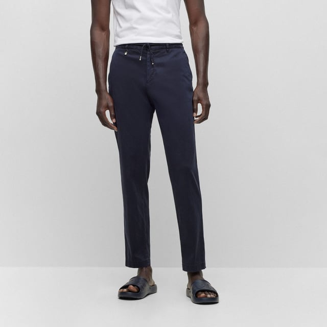 Mens BOSS C-Genius-D-RDS-234F Slim Fit Stretch Trousers with Drawstring Waist in dark blueSlim fit trousers made from stretch fabric with drawstring waistband.- Slim fit- Mid rise- Hook and zip closure- Elasticated waist with drawstring- Front slant pockets- Rear buttoned welt pockets- 64% Lyocell  34% Cotton  2% Elastane.  Machine washable.- Ref: 50501880-404