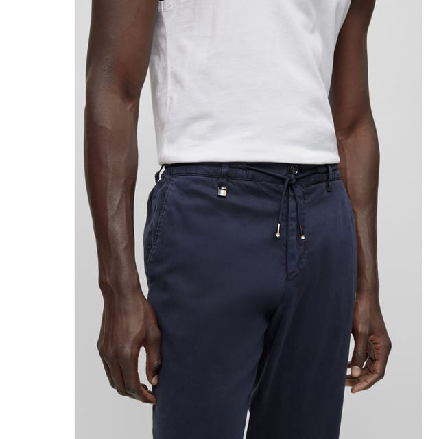 Mens BOSS C-Genius-D-RDS-234F Slim Fit Stretch Trousers with Drawstring Waist in dark blueSlim fit trousers made from stretch fabric with drawstring waistband.- Slim fit- Mid rise- Hook and zip closure- Elasticated waist with drawstring- Front slant pockets- Rear buttoned welt pockets- 64% Lyocell  34% Cotton  2% Elastane.  Machine washable.- Ref: 50501880-404
