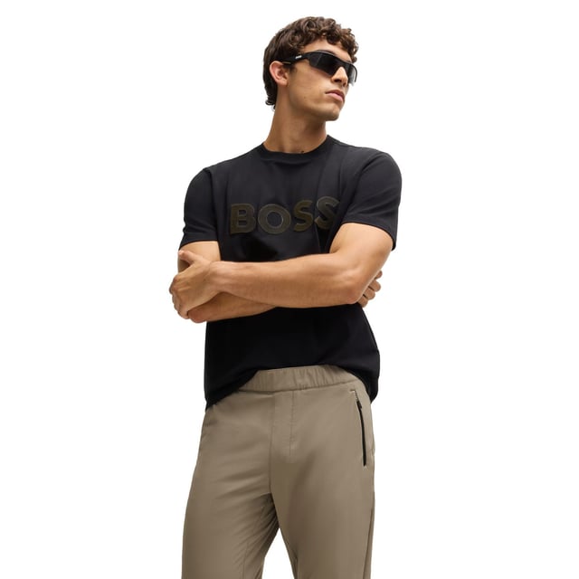 Mens BOSS T Basin Tapered-leg trousers in water-repellent stretch fabric in beigeThese BOSS Menswear tapered-fit trousers have adjustability at the waist and hems. Expand your wardrobe with this versatile pair crafted in stretch material with water repellency.- Elasticated waistband with inner drawcord- Zipped front pockets- Tapered leg- Snap buttons on hem- Technical 4-way stretch for maximum freedom of movement- Quick-dry  water-repellent and easy iron.- Main material: 90% Polyamide  10% Elastane.  Pocketing: 100% Polyester.  Machine washable.- Ref: 50529668-334