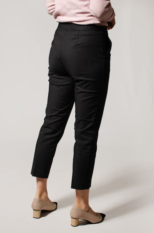 These trousers offer easy wear for smart and casual occasions alike. They have tapered legs with added stretch for comfort and an ankle-grazer length for a contemporary look. The elasticated high waist features double darts for a tailored effect and fastens securely with a hook bar and zip with a concealed button.