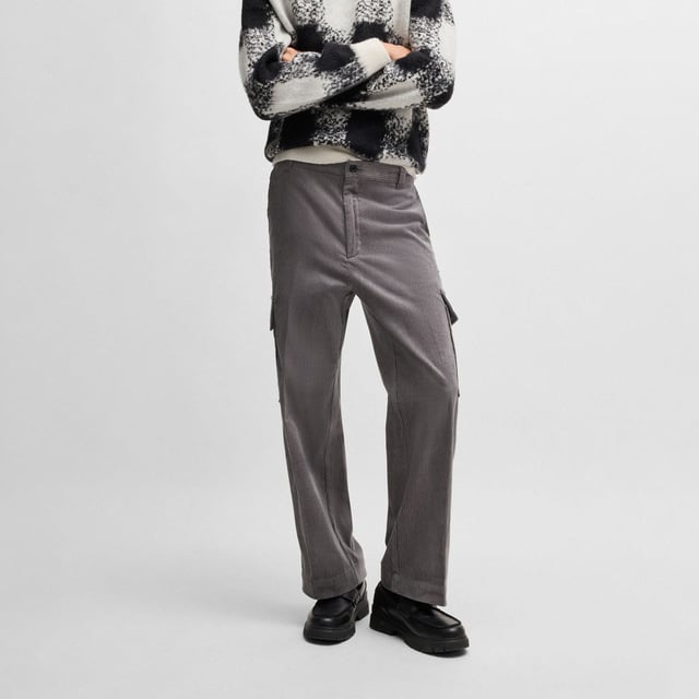 Mens HUGO Grady244 Regular Fit Cargo Trousers in Cotton Corduroy in medium greyTrend-driven cargo trousers made in cotton corduroy by HUGO. This pair is cut to a straight fit for a casual silhouette.- Regular fit.- Button and zip closure.- Belt loops.- Side pockets and back welt pockets.- Side cargo pockets.- Straight leg.- Main material: 100% Cotton.  Pocketing: 65% Polyester  35% Cotton.  Machine washable.- Ref: 50521138-034