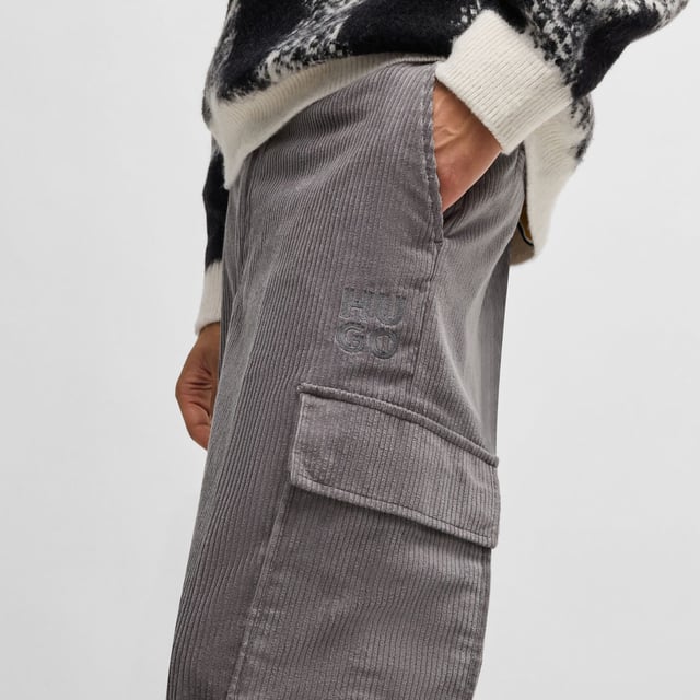 Mens HUGO Grady244 Regular Fit Cargo Trousers in Cotton Corduroy in medium greyTrend-driven cargo trousers made in cotton corduroy by HUGO. This pair is cut to a straight fit for a casual silhouette.- Regular fit.- Button and zip closure.- Belt loops.- Side pockets and back welt pockets.- Side cargo pockets.- Straight leg.- Main material: 100% Cotton.  Pocketing: 65% Polyester  35% Cotton.  Machine washable.- Ref: 50521138-034