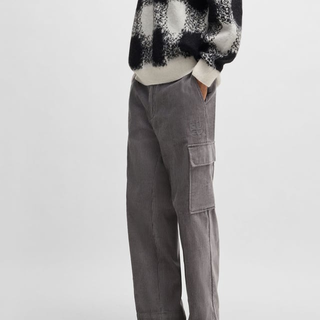 Mens HUGO Grady244 Regular Fit Cargo Trousers in Cotton Corduroy in medium greyTrend-driven cargo trousers made in cotton corduroy by HUGO. This pair is cut to a straight fit for a casual silhouette.- Regular fit.- Button and zip closure.- Belt loops.- Side pockets and back welt pockets.- Side cargo pockets.- Straight leg.- Main material: 100% Cotton.  Pocketing: 65% Polyester  35% Cotton.  Machine washable.- Ref: 50521138-034