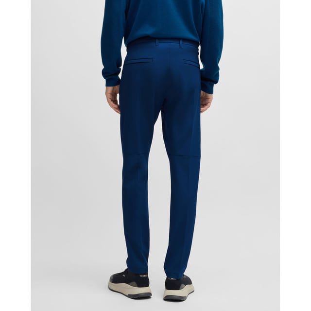 Mens BOSS T Commuter Slim-Fit Chinos in easy-iron four-way stretch fabric in open blueTimeless slim-fit chinos by BOSS Menswear  crafted from easy-iron four-way stretch fabric for optimum comfort. Designed with a quick-dry  water-repellent finish. Featuring a customisable waistband with drawstrings that can be worn inside or out  along with an integrated card-holder and coin-catcher pocket for wallet-free commuting.-Slim fit- Regular rise- Button and zip closure- Tapered leg- Pockets bottom back: Patch pocket- Fit foot width: 33cm- 92% Polyester  8% Elastane  pocketing: 100% Polyester.  Machine washable- Ref: 50495497-494