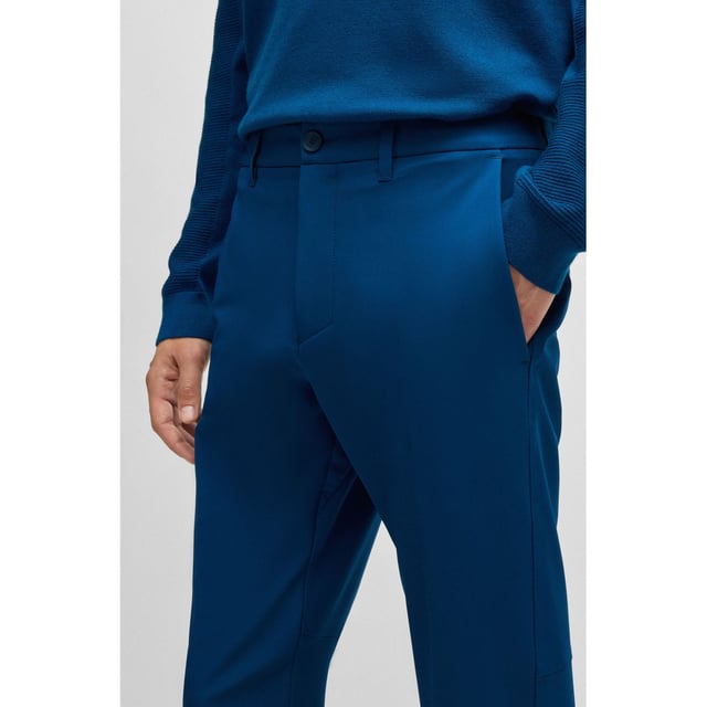 Mens BOSS T Commuter Slim-Fit Chinos in easy-iron four-way stretch fabric in open blueTimeless slim-fit chinos by BOSS Menswear  crafted from easy-iron four-way stretch fabric for optimum comfort. Designed with a quick-dry  water-repellent finish. Featuring a customisable waistband with drawstrings that can be worn inside or out  along with an integrated card-holder and coin-catcher pocket for wallet-free commuting.-Slim fit- Regular rise- Button and zip closure- Tapered leg- Pockets bottom back: Patch pocket- Fit foot width: 33cm- 92% Polyester  8% Elastane  pocketing: 100% Polyester.  Machine washable- Ref: 50495497-494