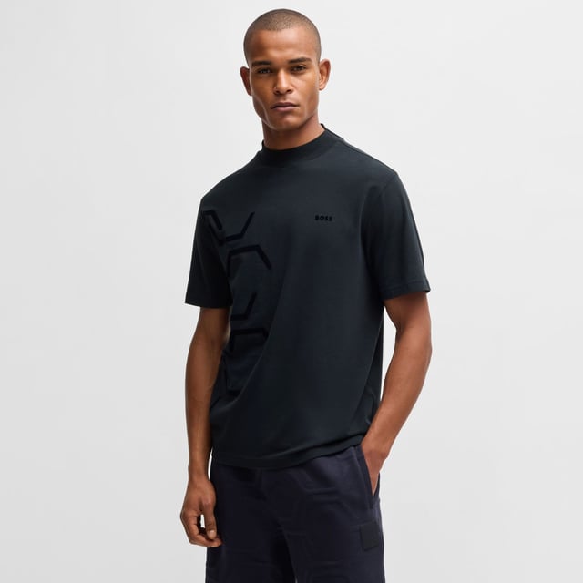 Mens BOSS Tock Hexaquilt Stretch-cotton T-shirt with graphic hexagonal artwork in dark blueCut to a relaxed fit  BOSS Menswear's T-shirt has tonal hexagonal artwork for a dynamic look. Stretch-cotton jersey  mock neckline  branding.- Relaxed fit- Crew neck- Short sleeves- Standard length- 95% Cotton  5% Elastane.  Machine washable.- Ref: 50531570-402