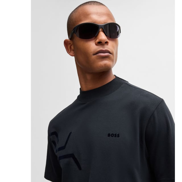 Mens BOSS Tock Hexaquilt Stretch-cotton T-shirt with graphic hexagonal artwork in dark blueCut to a relaxed fit  BOSS Menswear's T-shirt has tonal hexagonal artwork for a dynamic look. Stretch-cotton jersey  mock neckline  branding.- Relaxed fit- Crew neck- Short sleeves- Standard length- 95% Cotton  5% Elastane.  Machine washable.- Ref: 50531570-402