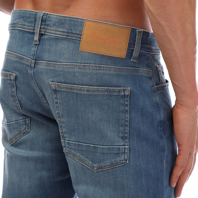 Mens Hugo Boss Delaware BC Slim-Fit Jeans in blue.- Button and zip closure.- 5 pockets design.- Regular rise.- BOSS branding.- Slim fit.- 75% Cotton  17% Polyester  6% Elastomultiester  2% Elastane.- Ref: 50496453433