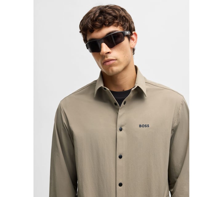 Mens BOSS Basin Relaxed-Fit Overshirt in Water-Repellent Stretch Fabric in beigeWith elbow darts for an ergonomic fit  this BOSS Menswear overshirt is cut in super-stretch fabric. Quick-dry performance with an easy-iron finish.- Relaxed fit- Kent collar- Squared cuffs- Standard length- 90% Polyamide  10% Elastane.  Machine washable.- Ref: 50533265-334