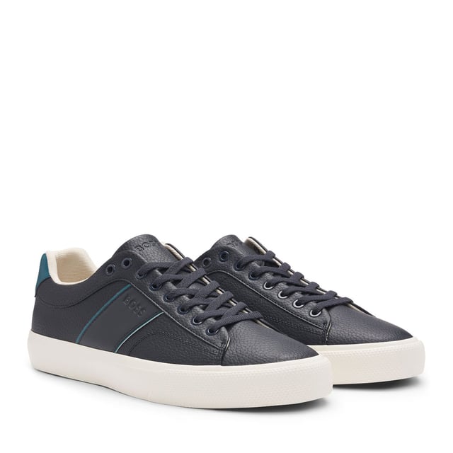 Men's Boss Aiden Tennis Trainers in Blue Mens BOSS Aiden Faux-Leather Trainers with plain and grained textures in open blue.Sporty trainers with piping and debossed branding by BOSS. This pair is crafted in synthetic coated fabric with grained and plain finishes. Synthetic coated fabric sometimes referred to as faux leather is a fabric designed to resemble real leather and-or display a matte glossy smooth or textured coated appearance. - Laces- Fully lined- Packaging: Box- Upper material: 60% Polyurethane 40% Polyester. Lining: 100% Polyester 85% Polyester 15% Polyurethane. Sole: 100% Rubber. Innersole: 100% Polyester.- Ref: 50522833-464