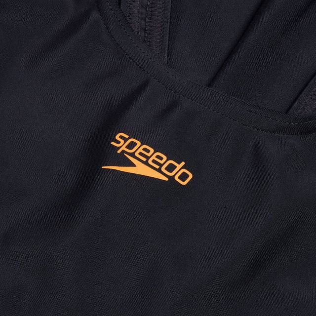 Speedo Placement Muscleback One-Piece Swimsuit. Feel confident and streamlined wearing our sporty black Muscleback, featuring a dynamic drop-ripple graphic in orange. A favourite amongst young swimmers, the muscleback style features thick straps that free up the shoulder blades to allow a full range of motion in lessons and training. Ideal for regular pool sessions, our EnduraFlex fabric offers higher chlorine resistance than standard swimwear fabrics and fits like new for longer with CREORA® HighClo™. In addition, nylon yarns in the EnduraFlex fabric are made from 100% pre-consumer waste, such as waste fabric from factories. Ref: 80832417523.