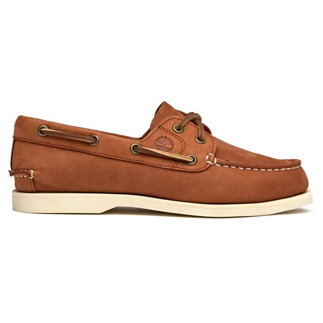 Classic maritime style meets everyday comfort in these women's boat shoes from Timberland. The soft tan nubuck upper offers a premium feel while the flexible rubber sole provides reliable grip whether you're dockside or downtown. A cushioned insock ensures all-day wearability, making these versatile enough to pair with everything from crisp white jeans to flowing summer dresses.
