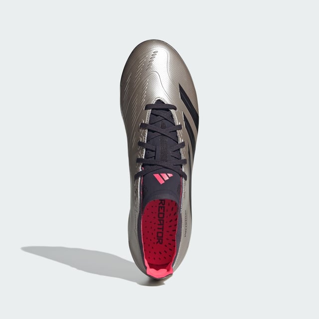 When the goal's in your sights, adidas Predator converts pressure into pinpoint accuracy. The Hybridfeel upper on these League football boots includes an all-over 3D texture and grippy Strikescale fins to improve shooting precision. A specialist artificial grass outsole digs into 2G and 3G pitches so you're always ready to fire.By choosing recycled, adidas are able to reuse materials that have already been created, which helps to reduce waste. Renewable materials choices will help us to remove our reliance on finite resources. Our products made with a blend of recycled and renewable materials feature at least 20% total of these materials.  - Regular fit - Lace closure - Hybridfeel upper with Strikescale elements - 2G and 3G artificial grass outsole - Contains a minimum of 20% recycled and renewable content  Shipped by adidas