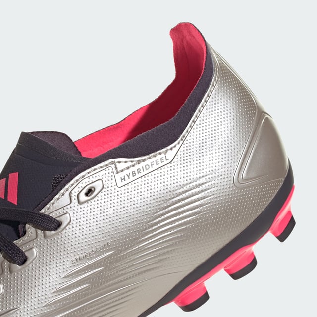 When the goal's in your sights, adidas Predator converts pressure into pinpoint accuracy. The Hybridfeel upper on these League football boots includes an all-over 3D texture and grippy Strikescale fins to improve shooting precision. A specialist artificial grass outsole digs into 2G and 3G pitches so you're always ready to fire.By choosing recycled, adidas are able to reuse materials that have already been created, which helps to reduce waste. Renewable materials choices will help us to remove our reliance on finite resources. Our products made with a blend of recycled and renewable materials feature at least 20% total of these materials.  - Regular fit - Lace closure - Hybridfeel upper with Strikescale elements - 2G and 3G artificial grass outsole - Contains a minimum of 20% recycled and renewable content  Shipped by adidas