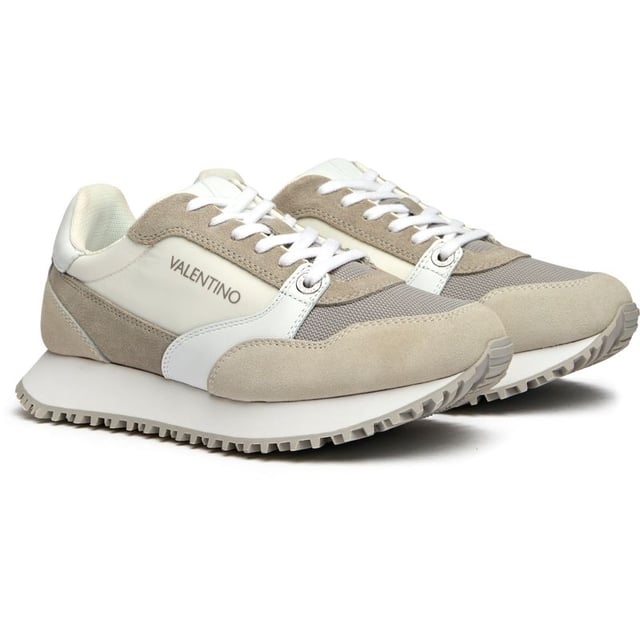 These pristine white suede trainers from Valentino blur the line between athletic performance and luxury fashion. The Italian craftsmanship shines through in every detail, from the plush suede upper to the supportive EVA sole that delivers all-day comfort. Complete with signature Valentino branding and presented in a branded shoe bag, the Dred trainers bring sophisticated sportswear sensibilities to your everyday wardrobe.