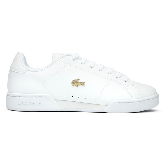 Lacoste Carnaby Cup Trainers The Lacoste Carnaby Cup delivers timeless court style with a modern twist. Crafted from quality leather, these women's white trainers showcase elegant metallic accents that catch the light with each step. The robust rubber cup sole provides excellent stability, while signature Lacoste branding adorns the tongue, heel, and quarter - subtle reminders of the heritage behind these sophisticated sneakers. Perfect for casual outings or dressing up your weekend attire.