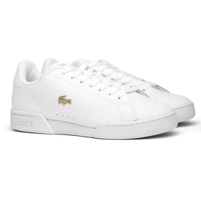 Lacoste Carnaby Cup Trainers The Lacoste Carnaby Cup delivers timeless court style with a modern twist. Crafted from quality leather, these women's white trainers showcase elegant metallic accents that catch the light with each step. The robust rubber cup sole provides excellent stability, while signature Lacoste branding adorns the tongue, heel, and quarter - subtle reminders of the heritage behind these sophisticated sneakers. Perfect for casual outings or dressing up your weekend attire.