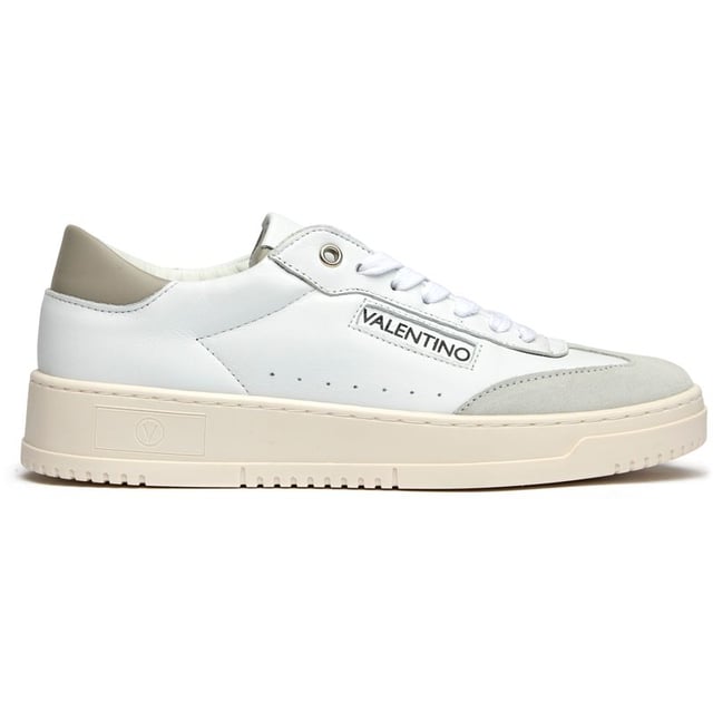 These pristine white leather trainers from Valentino blend Italian craftsmanship with contemporary court-inspired design. The Saturn silhouette features distinctive side stitch sole detailing and subtle Valentino branding for understated luxury. Crafted from premium leather with durable rubber soles, they arrive with a branded shoe bag to preserve their immaculate finish. Perfect for elevating casual looks with refined elegance.