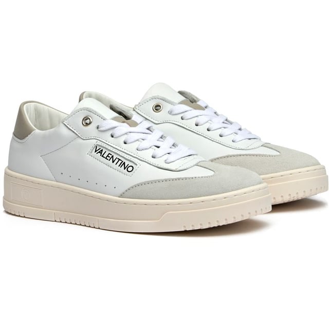 These pristine white leather trainers from Valentino blend Italian craftsmanship with contemporary court-inspired design. The Saturn silhouette features distinctive side stitch sole detailing and subtle Valentino branding for understated luxury. Crafted from premium leather with durable rubber soles, they arrive with a branded shoe bag to preserve their immaculate finish. Perfect for elevating casual looks with refined elegance.
