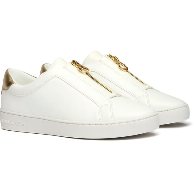 The Michael Kors Keaton Slip On combines luxury and convenience in a sleek court trainer design. Crafted with premium white leather uppers, these women's shoes offer a sophisticated yet casual aesthetic that pairs effortlessly with any outfit. The durable rubber sole provides reliable traction while maintaining the shoe's elegant profile. Perfect for the fashion-conscious woman seeking both comfort and style, these versatile trainers deliver the unmistakable Michael Kors quality in a fuss-free slip-on silhouette.