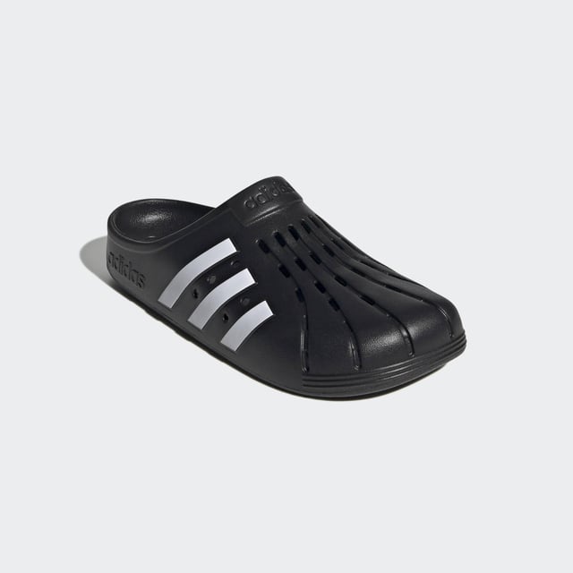 Adilette Clogs Based on the iconic adidas slide, these clogs are as functional as they are comfortable. Whether you're walking to the gym or pool for an early-morning workout or just want to keep the slouchy-casual vibe going all through your day, slip your feet into the contoured footbeds and head for the door. - Regular fit - Slip-on construction - Synthetic upper - Soft feel - Sport-inspired clogs for every day - Contoured EVA footbed - Synthetic outsole Shipped by adidas