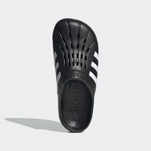 Adilette Clogs Based on the iconic adidas slide, these clogs are as functional as they are comfortable. Whether you're walking to the gym or pool for an early-morning workout or just want to keep the slouchy-casual vibe going all through your day, slip your feet into the contoured footbeds and head for the door. - Regular fit - Slip-on construction - Synthetic upper - Soft feel - Sport-inspired clogs for every day - Contoured EVA footbed - Synthetic outsole Shipped by adidas