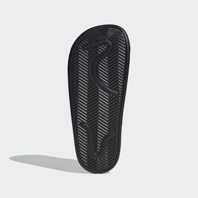 Adilette Clogs Based on the iconic adidas slide, these clogs are as functional as they are comfortable. Whether you're walking to the gym or pool for an early-morning workout or just want to keep the slouchy-casual vibe going all through your day, slip your feet into the contoured footbeds and head for the door. - Regular fit - Slip-on construction - Synthetic upper - Soft feel - Sport-inspired clogs for every day - Contoured EVA footbed - Synthetic outsole Shipped by adidas