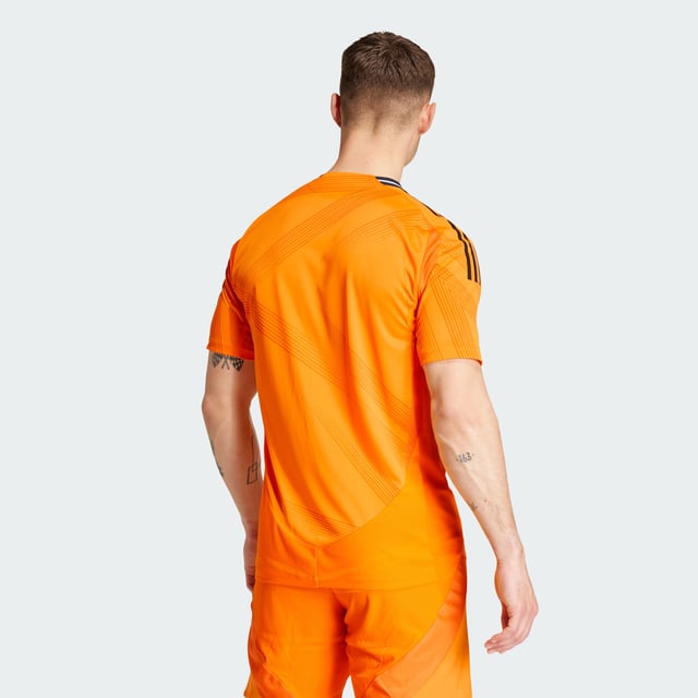 Highlighting the rise of a brand-new football generation. Created to complement Real Madrid's shimmering skills, this adidas away authentic jersey stands out with a vibrant orange base and an abstract, star-inspired design. Its metallic blue details include a heat-applied club badge. Behind the scenes, performance-boosting HEAT.RDY makes for effervescent play.This product is made with 100% recycled materials. By reusing materials that have already been created, adidas help to reduce waste and our reliance on finite resources and reduce the footprint of the products adidas make.  - Slim fit - Ribbed crewneck - 100% polyester (recycled) - HEAT.RDY - Side mesh inserts - Real Madrid heat-applied crest  Shipped by adidas