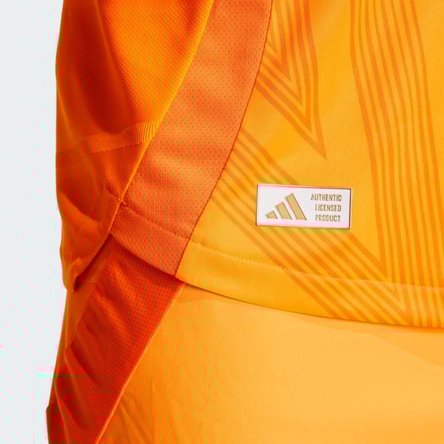 Highlighting the rise of a brand-new football generation. Created to complement Real Madrid's shimmering skills, this adidas away authentic jersey stands out with a vibrant orange base and an abstract, star-inspired design. Its metallic blue details include a heat-applied club badge. Behind the scenes, performance-boosting HEAT.RDY makes for effervescent play.This product is made with 100% recycled materials. By reusing materials that have already been created, adidas help to reduce waste and our reliance on finite resources and reduce the footprint of the products adidas make.  - Slim fit - Ribbed crewneck - 100% polyester (recycled) - HEAT.RDY - Side mesh inserts - Real Madrid heat-applied crest  Shipped by adidas