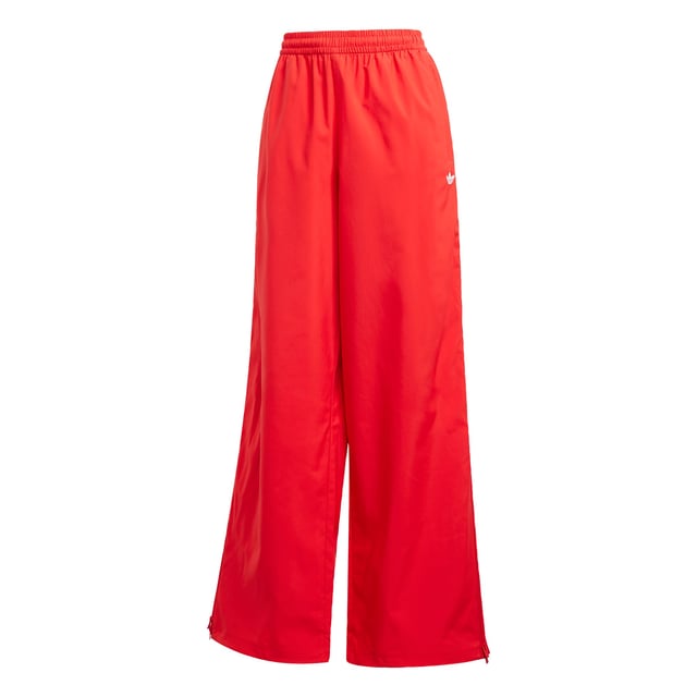 The 3-Stripes on these adidas pants have two purposes — celebrate their adidas DNA boldly, and to emphasise the wide leg silhouette. The flowing look can be adjusted at the cuffs, with a pearl at the stopper of the bungees for added decadence. A two-way zip on the side allows you to play with the aesthetic even further, by creating more of a balloon shape with the volume.This product is made with 100% recycled materials. By reusing materials that have already been created, adidas help to reduce waste and our reliance on finite resources and reduce the footprint of the products adidas make.  - Loose fit - Drawcord on elastic waist - 100% polyester (recycled) - Side pockets - Bungee-adjustable hems  Shipped by adidas