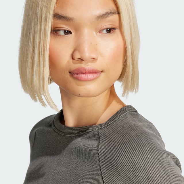 This adidas crop top is inspired by the bold attitudes and style of '90s hip hop. Soft ribbed fabric in a slim silhouette hugs the body while the long sleeves and crewneck give it a casual vibe. It's finished with a repeating Trefoil graphic along the hem.  - Slim fit with crop length - Crewneck - 95% cotton, 5% elastane  Shipped by adidas