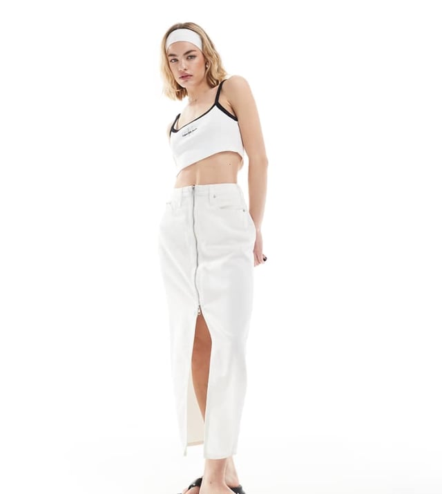 Skirts by Calvin Klein Jeans  High rise Zip fastening Functional pockets Branded patch to reverse Front split Regular fitSold By: Asos