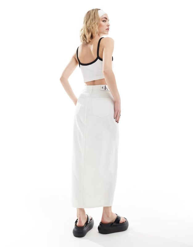 Skirts by Calvin Klein Jeans  High rise Zip fastening Functional pockets Branded patch to reverse Front split Regular fitSold By: Asos