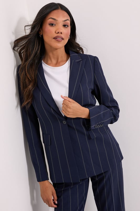 Stripe Single Breasted Blazer Striking check pattern blazer with classic single-breasted design
Regular fit silhouette offering comfortable movement throughout the day
Notched lapels and structured shoulders for a polished appearance
Functional front pockets perfect for small essentials
Versatile woven fabric with slight stretch for all-day comfort
This Dorothy Perkins Check Single Breasted Blazer brings contemporary charm to casual daywear. The distinctive check pattern creates visual interest while maintaining versatility for numerous styling options. Pair with matching trousers as shown for a coordinated set that works wonderfully for brunch dates or family gatherings. For a more relaxed approach, style with your favourite denim jeans and a simple white tee, finishing with white trainers for an effortlessly chic weekend look. The regular fit ensures comfort without compromising on style, making it ideal for coffee catch-ups or informal work meetings. Layer over a lightweight jumper during cooler months or wear with a camisole when temperatures rise. This blazer seamlessly transitions from day to evening, allowing you to customise your look for various casual occasions.