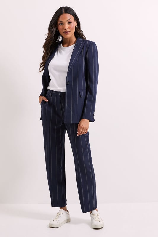 Stripe Single Breasted Blazer Striking check pattern blazer with classic single-breasted design
Regular fit silhouette offering comfortable movement throughout the day
Notched lapels and structured shoulders for a polished appearance
Functional front pockets perfect for small essentials
Versatile woven fabric with slight stretch for all-day comfort
This Dorothy Perkins Check Single Breasted Blazer brings contemporary charm to casual daywear. The distinctive check pattern creates visual interest while maintaining versatility for numerous styling options. Pair with matching trousers as shown for a coordinated set that works wonderfully for brunch dates or family gatherings. For a more relaxed approach, style with your favourite denim jeans and a simple white tee, finishing with white trainers for an effortlessly chic weekend look. The regular fit ensures comfort without compromising on style, making it ideal for coffee catch-ups or informal work meetings. Layer over a lightweight jumper during cooler months or wear with a camisole when temperatures rise. This blazer seamlessly transitions from day to evening, allowing you to customise your look for various casual occasions.