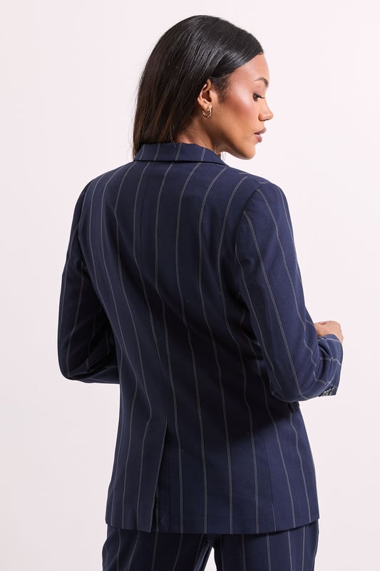Stripe Single Breasted Blazer Striking check pattern blazer with classic single-breasted design
Regular fit silhouette offering comfortable movement throughout the day
Notched lapels and structured shoulders for a polished appearance
Functional front pockets perfect for small essentials
Versatile woven fabric with slight stretch for all-day comfort
This Dorothy Perkins Check Single Breasted Blazer brings contemporary charm to casual daywear. The distinctive check pattern creates visual interest while maintaining versatility for numerous styling options. Pair with matching trousers as shown for a coordinated set that works wonderfully for brunch dates or family gatherings. For a more relaxed approach, style with your favourite denim jeans and a simple white tee, finishing with white trainers for an effortlessly chic weekend look. The regular fit ensures comfort without compromising on style, making it ideal for coffee catch-ups or informal work meetings. Layer over a lightweight jumper during cooler months or wear with a camisole when temperatures rise. This blazer seamlessly transitions from day to evening, allowing you to customise your look for various casual occasions.