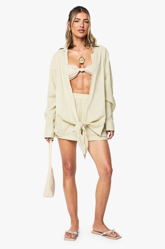 Linen Knot Front Tunic Make a splash in our stylish swimwearBagging yourself the perfect bikini is the secret to feeling body beautiful at the beach. Whether you prefer triangle or bandeau, high waisted or hipster, we’ve got swimwear styles to flatter every figure. This season we’re talking about the tropical two piece, clashing it with a quirky kimono and adding fashion’s hottest headwear, the floppy hat, for plenty of poolside pizazz.