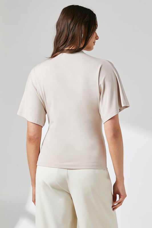 Elegant flutter sleeves for a soft, feminine silhouette
        Distinctive asymmetric zip detail adding contemporary flair
        Flattering crew neckline with subtle gathering detail
        Smooth jersey fabric offering comfortable stretch and movement
        Regular fit design perfect for versatile styling options
    
    This Principles top combines effortless style with practical comfort for your everyday wardrobe. The delicate flutter sleeves create a graceful drape while the unique asymmetric zip detail adds a modern twist to this otherwise classic piece. The gentle gathering at the neckline creates subtle texture and dimension that flatters your dcolletage. Style with wide-leg trousers as shown for a polished daytime look, perfect for family gatherings or weekend brunches. For casual outings, pair with your favourite denim and trainers, or dress up with tailored trousers and ballet flats for office wear. The stretchy jersey composition ensures all-day comfort without compromising on style, making this a versatile piece that transitions seamlessly from morning coffee runs to afternoon shopping trips.