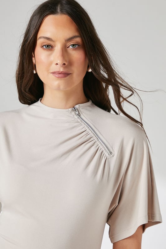 Elegant flutter sleeves for a soft, feminine silhouette
        Distinctive asymmetric zip detail adding contemporary flair
        Flattering crew neckline with subtle gathering detail
        Smooth jersey fabric offering comfortable stretch and movement
        Regular fit design perfect for versatile styling options
    
    This Principles top combines effortless style with practical comfort for your everyday wardrobe. The delicate flutter sleeves create a graceful drape while the unique asymmetric zip detail adds a modern twist to this otherwise classic piece. The gentle gathering at the neckline creates subtle texture and dimension that flatters your dcolletage. Style with wide-leg trousers as shown for a polished daytime look, perfect for family gatherings or weekend brunches. For casual outings, pair with your favourite denim and trainers, or dress up with tailored trousers and ballet flats for office wear. The stretchy jersey composition ensures all-day comfort without compromising on style, making this a versatile piece that transitions seamlessly from morning coffee runs to afternoon shopping trips.