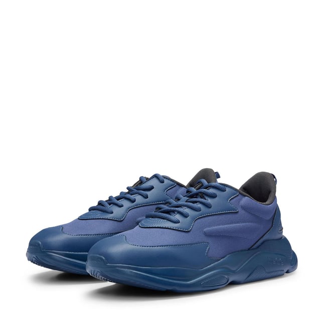 Mens HUGO Leon Running-Inspired Trainers with contrast details in navySignature trainers by HUGO  set on an EVA outsole and crafted in a mix of materials with contrast detailing and branding throughout.- Laces- Partially lined- Packaging: Box- Upper material: 100% Polyester.  Lining: 100% Polyester.  Sole: 100% Ethylene vinyl acetate.  Facing: 60% Polyester  40% Polyurethane.  Innersole: 100% Polyester.- Ref: 50517096-413