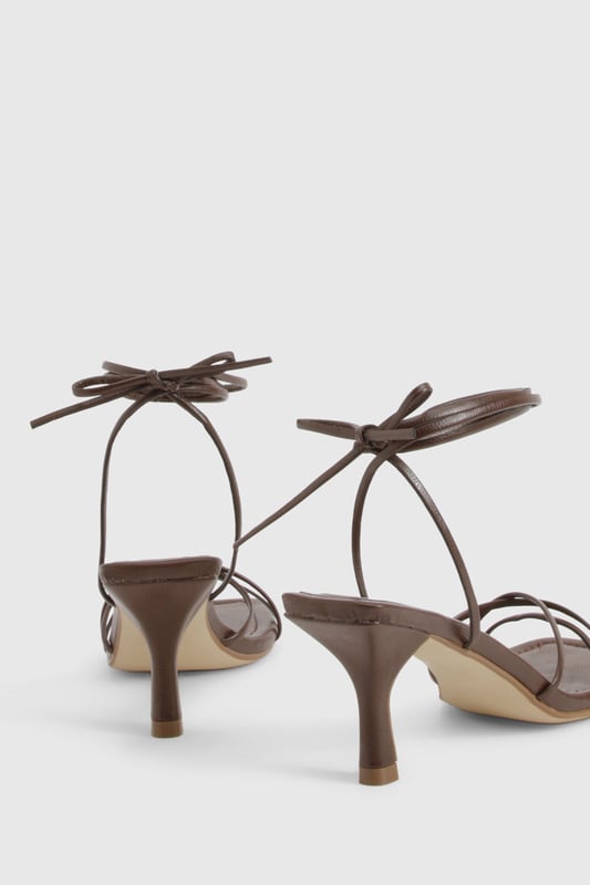We'll make sure your shoes keep you one stylish step ahead of the crowdWhether you're keeping it simple in sliders, living the high life in heels or joining the fash pack in flatforms, you'll be heading to shoe heaven with our fashion-forward footwear collection. Boots are your day-to-night bestfriend, giving a floral dress&nbsp;that tough twist - add a biker jacket for even more attitude. Find your summer feet in jelly sandals and enjoy balmy nights in block heels.