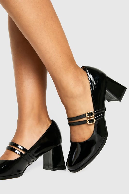 Glossy patent finish for a striking, eye-catching look
        Double strap design with elegant gold-tone buckle detailing
        Classic square toe silhouette for a modern twist on the Mary Jane style
        Comfortable mid block heel measuring between 5-6.5cm in height
        Cushioned insole for all-day wearability and comfort
    
    These Block Heel Double Strap Mary Janes from Boohoo offer a contemporary take on a timeless classic. The distinctive double strap design with polished buckle detailing creates a playful yet sophisticated silhouette that works beautifully for various occasions. Style them with cropped trousers and a crisp blouse for office attire, or pair with a floaty midi dress for family gatherings. The square toe and block heel combination delivers both stability and style, making these shoes perfect for occasions where you'll be on your feet. The patent finish adds a touch of glamour to even the simplest outfit, whilst the mid-height heel strikes the ideal balance between elegance and practicality. These versatile Mary Janes will quickly become a go-to in your footwear collection, offering endless styling possibilities throughout the seasons.