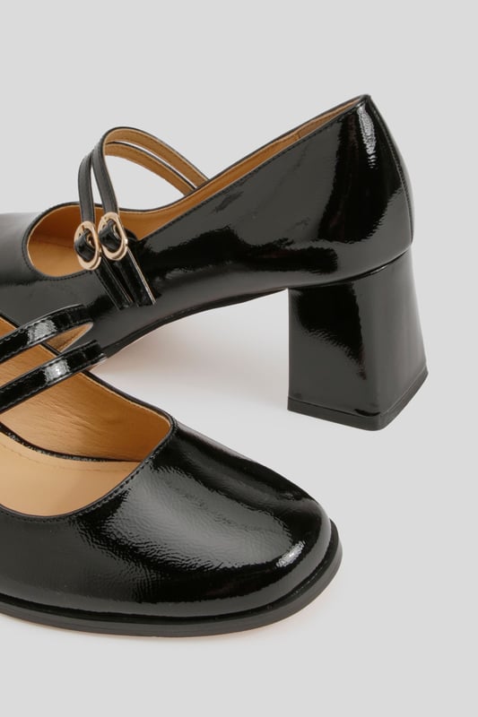 Glossy patent finish for a striking, eye-catching look
        Double strap design with elegant gold-tone buckle detailing
        Classic square toe silhouette for a modern twist on the Mary Jane style
        Comfortable mid block heel measuring between 5-6.5cm in height
        Cushioned insole for all-day wearability and comfort
    
    These Block Heel Double Strap Mary Janes from Boohoo offer a contemporary take on a timeless classic. The distinctive double strap design with polished buckle detailing creates a playful yet sophisticated silhouette that works beautifully for various occasions. Style them with cropped trousers and a crisp blouse for office attire, or pair with a floaty midi dress for family gatherings. The square toe and block heel combination delivers both stability and style, making these shoes perfect for occasions where you'll be on your feet. The patent finish adds a touch of glamour to even the simplest outfit, whilst the mid-height heel strikes the ideal balance between elegance and practicality. These versatile Mary Janes will quickly become a go-to in your footwear collection, offering endless styling possibilities throughout the seasons.