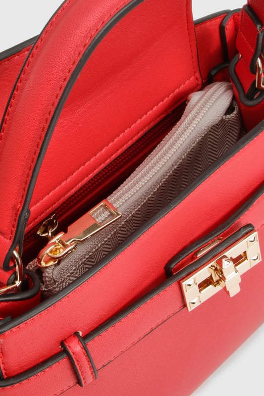 Structured mini bag with elegant buckle strap detail across the front
        Sophisticated gold-tone hardware adds a touch of glamour
        Practical top handle for easy carrying
        Compact yet spacious interior with organised compartments
        Versatile design perfect for day-to-night transitions
    
    This chic Buckle Strap Detail Mini Bag from Boohoo is the ultimate accessory for your night out ensemble. The structured silhouette creates a polished look while the distinctive buckle detail adds character to this compact piece. Despite its mini size, the bag offers surprising functionality with interior compartments to keep your essentials organised. Style with a crisp white crop top and high-waisted shorts for casual drinks, or pair with your favourite bodycon dress and strappy heels when hitting the club. The top handle design allows for effortless carrying while dancing the night away. This versatile piece works brilliantly for everything from casual meet-ups with friends to more glamorous evening occasions, ensuring you'll always have the perfect finishing touch for your going-out wardrobe.