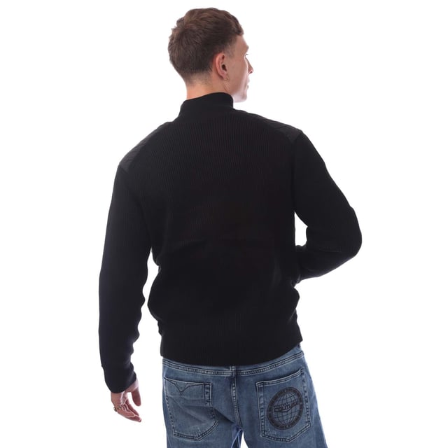 Mens Hugo Boss Kydalnrio Hybrid Jacket in black.- Funnel neck.- Full zip fastening.- Two front pockets.- Ribbed cuffs and hem.- Nylon front.- Square Boss badge on the chest.- Knitted.- 40% Acrylic  39% Virgin Wool  18% Polyamide  3% Elastane.- Ref: 50531494001